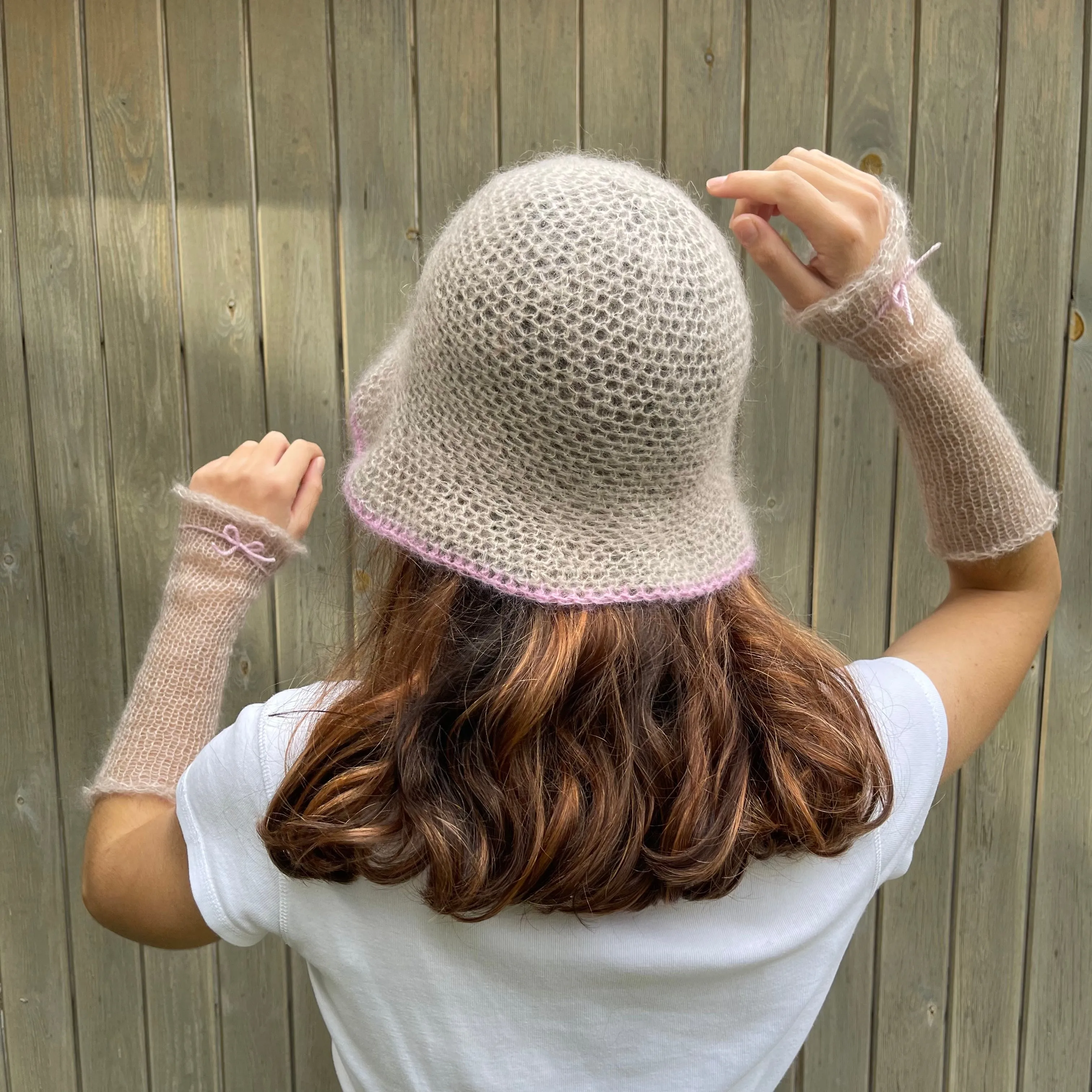 Handmade crochet mohair bucket hat in beige with baby pink trim