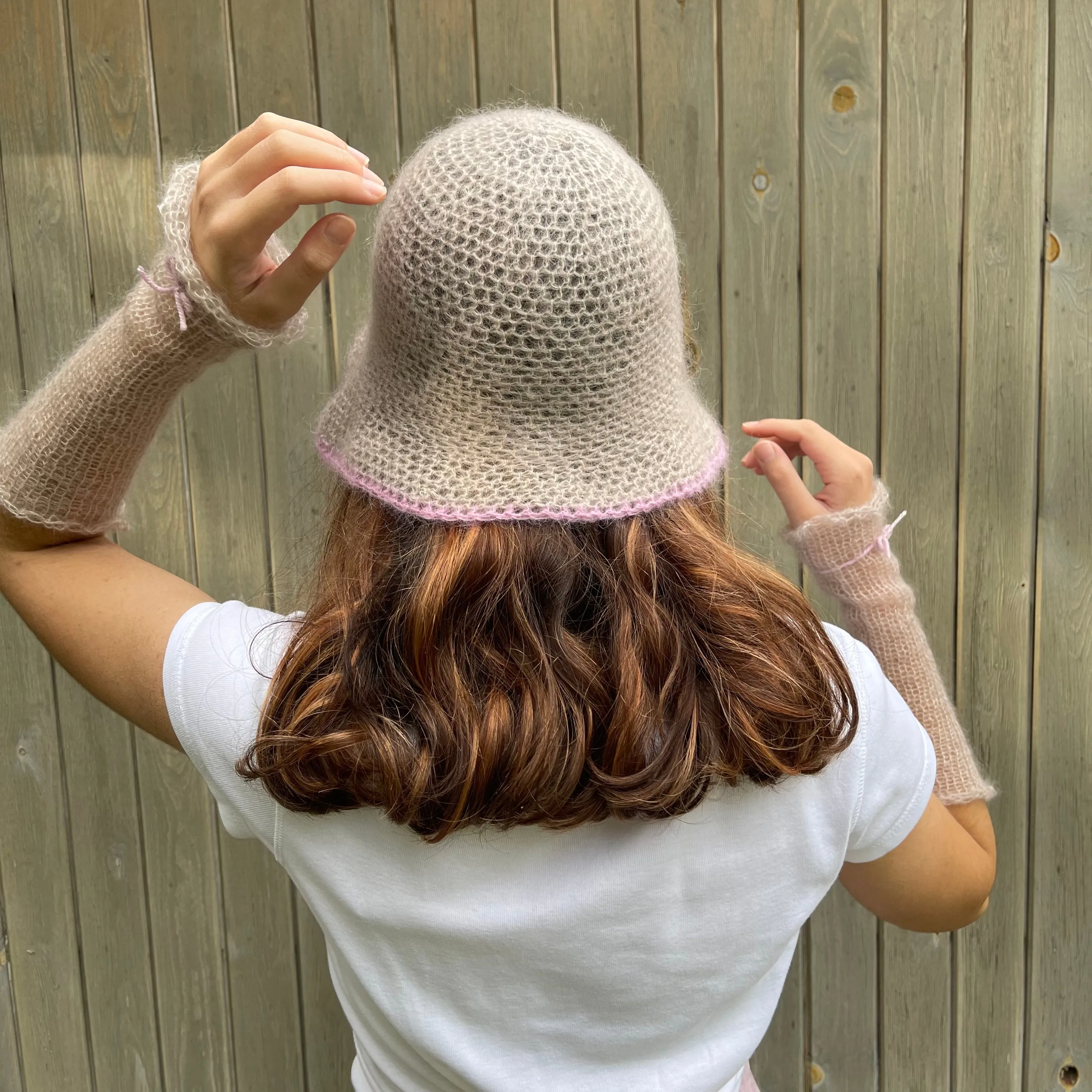 Handmade crochet mohair bucket hat in beige with baby pink trim