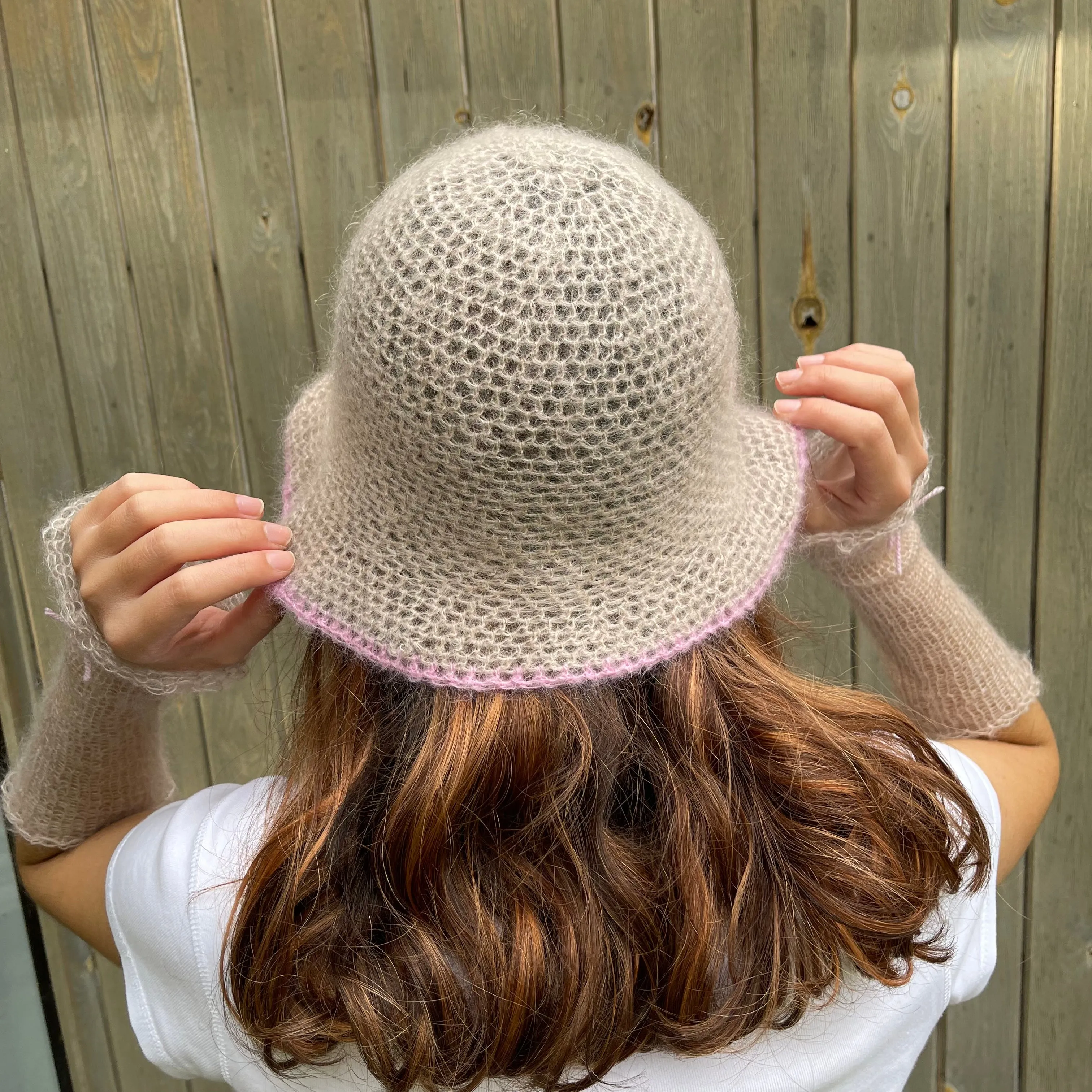 Handmade crochet mohair bucket hat in beige with baby pink trim