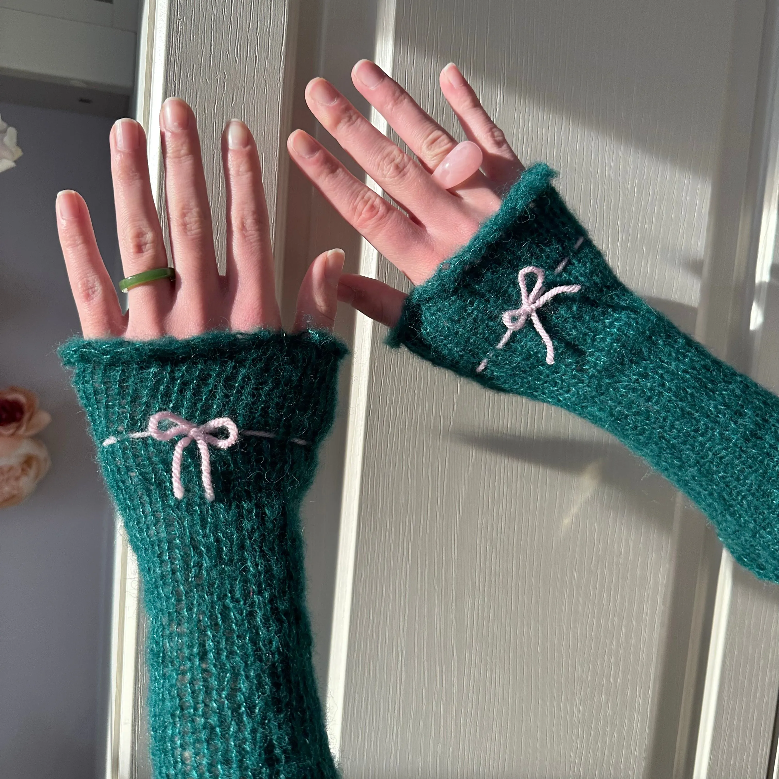 Handmade knitted mohair bow gloves in emerald green and baby pink - with thumb hole