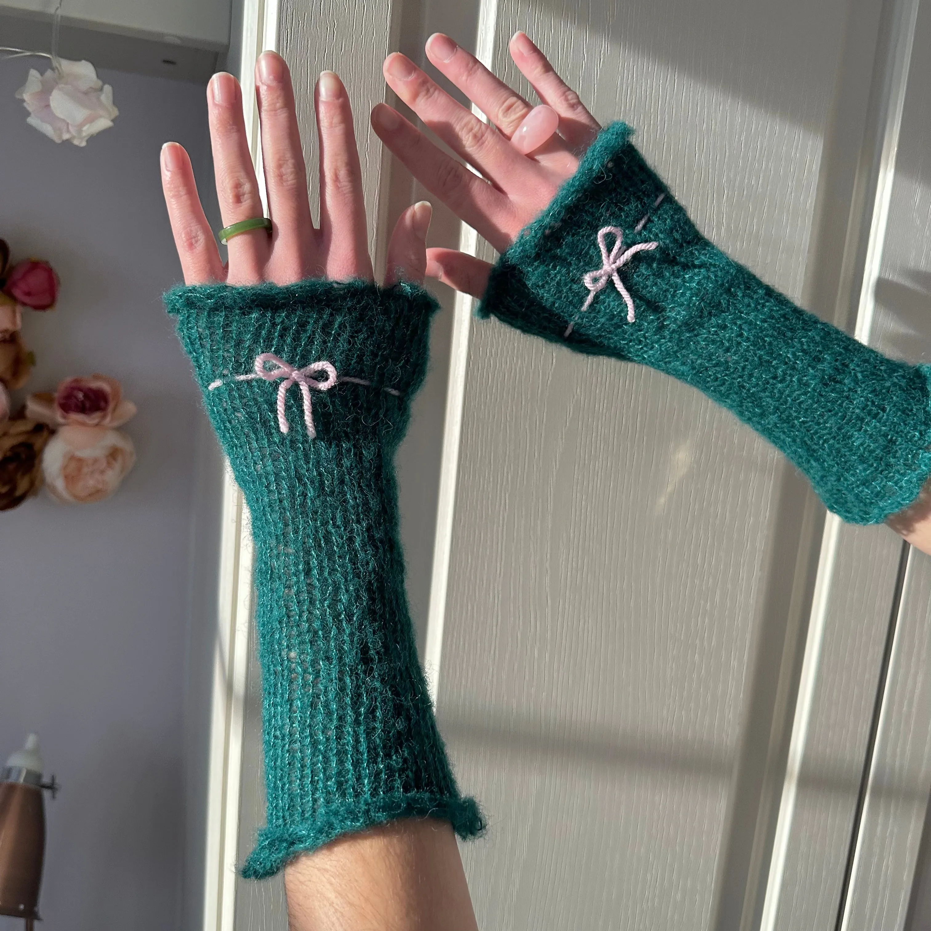 Handmade knitted mohair bow gloves in emerald green and baby pink - with thumb hole