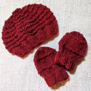 Red hand-knitted baby gift set